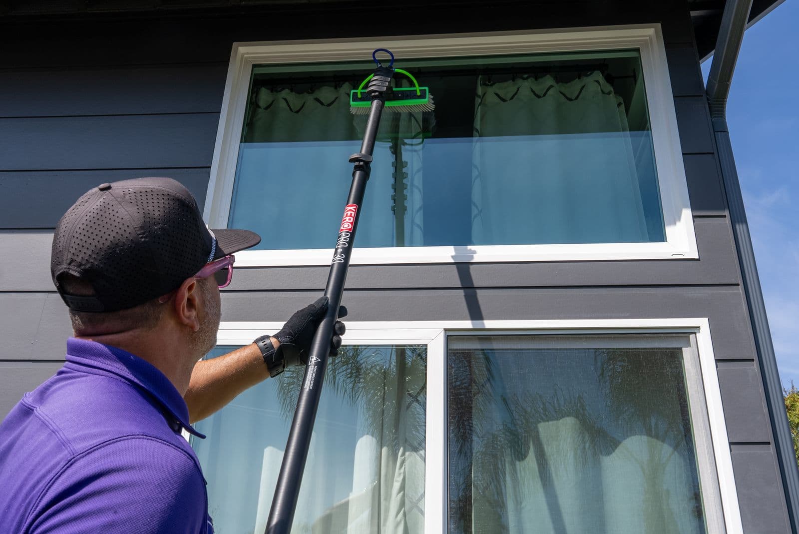 Window cleaning on a modern San Diego home