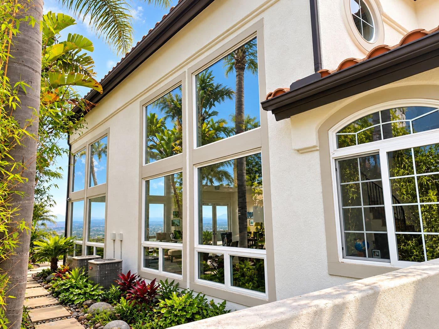 Clean arched windows on a stucco home
